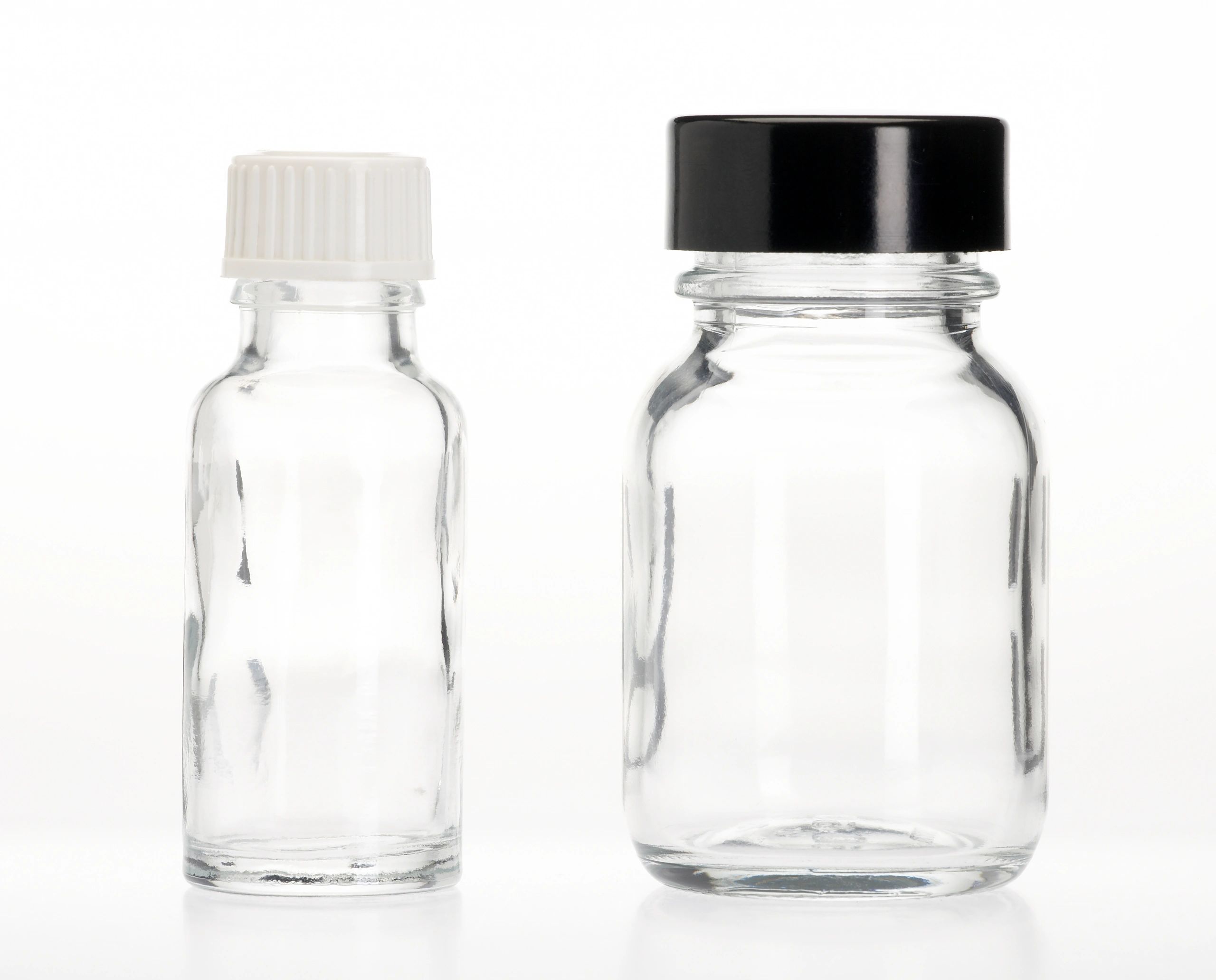 Clean supplement bottles on a minimal background